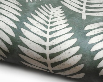 May include: A close-up of a green fabric with a white fern leaf pattern. The fabric has a textured, slightly distressed look.