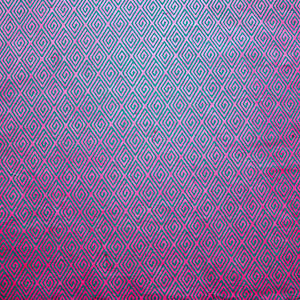 May include: A close-up of a fabric with a repeating geometric pattern. The pattern consists of teal-colored interlocking squares on a magenta background. The fabric has a slight sheen, and the pattern is evenly distributed across the surface.