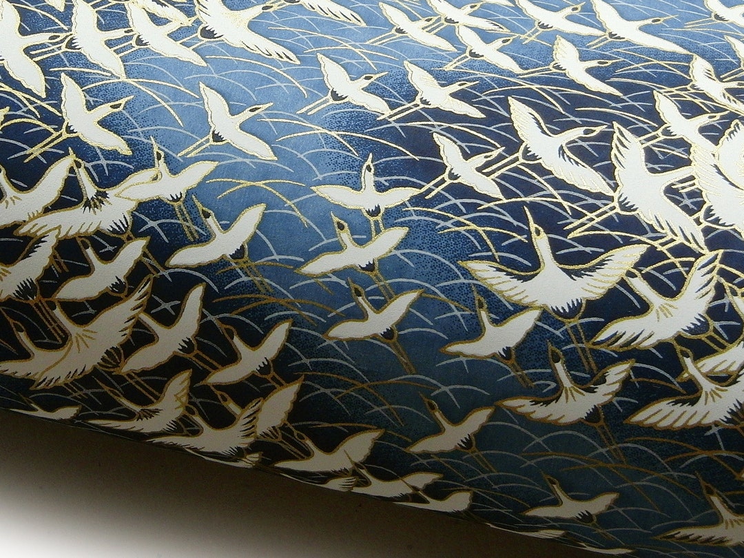 Japanese Paper Yuzen cranes Flight Above Ocean. White and Gold on Blue ...