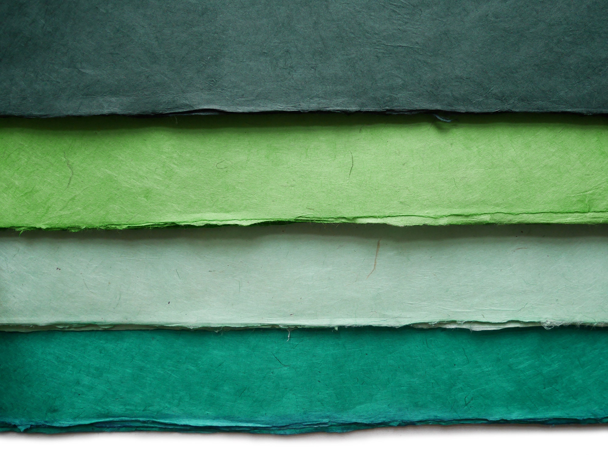 Lokta paper. Shades of green. Handmade Nepalese paper.