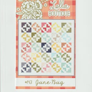 May include: A colorful quilt pattern featuring a patchwork design with various geometric shapes in shades of blue, pink, yellow, and green. The quilt is framed with a red and white plaid border. The text "Lella Boutique" and "#143 June Bug" are also visible.