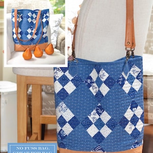 May include: A blue and white denim patchwork tote bag with brown leather straps and handles. The bag is sitting on a wooden chair. The text "Denim Patchwork Tote" is at the top of the image. The text "NO FUSS BAG. GREAT FOR BAG BEGINNERS!" is in a blue box at the bottom of the image. The text "FIG TREE & CO." is at the bottom of the image.