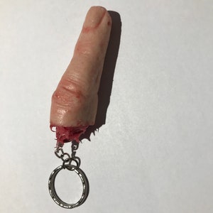 Severed silicone finger on a keyring