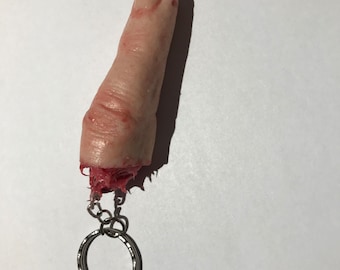 Severed silicone finger on a keyring