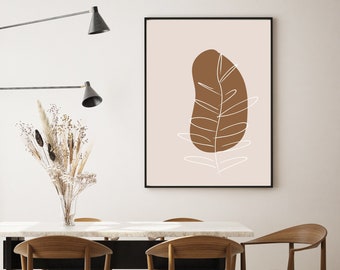 May include: A minimalist dining room with a white marble table and four wooden chairs. A wall-mounted light fixture with three black shades hangs above the table. A framed print with a brown leaf design hangs on the wall behind the table.