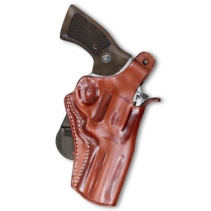 May include: A brown leather holster for a handgun. The holster has a stitched design and a belt loop.