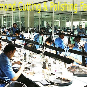 May include: An interior shot of a diamond cutting and polishing factory. Numerous workers in blue shirts are seated at workstations, each illuminated by a desk lamp. The text "Diamond Cutting & Polishing Factory" is visible at the top.