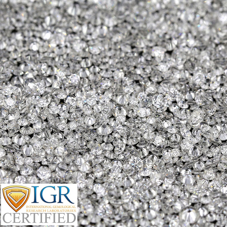 May include: A close-up shot of a large collection of sparkling, round-cut diamonds. The diamonds are clear and reflect light, creating a brilliant display. The image includes the text "IGR CERTIFIED" from the International Gemological Research Laboratories.