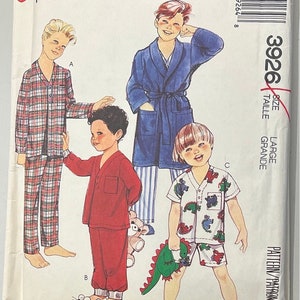 May include: A sewing pattern for children's pyjamas. The pattern includes three different styles: a plaid pyjama set, a red pyjama set, and a blue and white pyjama set with a dinosaur print. The pattern is for size large.