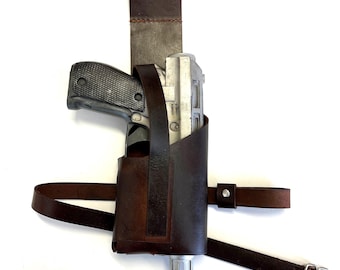 May include: A brown leather holster with a strap for a gun. The holster is designed to be worn on the hip.