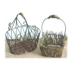 May include: Two decorative baskets. One is a dark green metal wire basket with a woven brown base and a woven handle. The other is a small basket made of twigs and green metal wire.