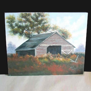 May include: A painting of a rustic wooden barn with a gray roof, set against a backdrop of a green field and a blue sky. The barn has a large open door and is surrounded by a field of wildflowers. The painting is signed "Earl Murphey" in the lower right corner.