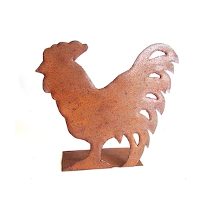 May include: A rustic metal rooster silhouette, featuring a detailed comb, wattle, and tail feathers. The brown sculpture stands on a rectangular base. This decorative piece adds a touch of farmhouse charm.