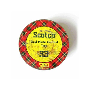May include: Vintage Scotch brand vinyl plastic electrical tape in a round tin. The tin has a red and black plaid pattern around a yellow center. The center features the brand name, product information, and the number 33.