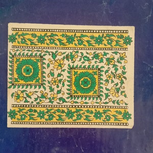 Colorido arte textil indio en papel hecho a mano