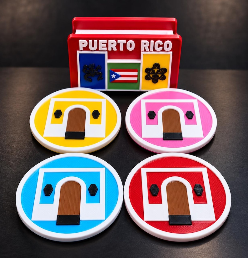 May include: A red rectangular holder with the text PUERTO RICO, a flag, and two black symbols, accompanied by four circular coasters. Each coaster features a white archway design on a yellow, pink, blue, or red background with brown doors.