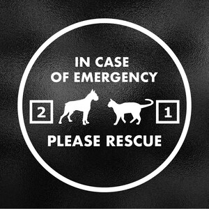 May include: A white circle with a black background and the text "IN CASE OF EMERGENCY" at the top.  Below the text are two silhouettes of animals, a dog and a cat, with numbers "2" and "1" next to them.  The text "PLEASE RESCUE" is at the bottom of the circle.