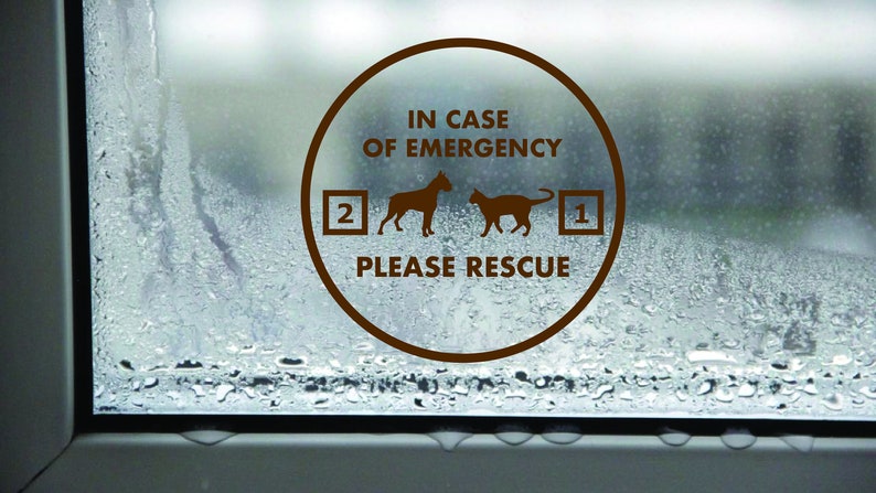 May include: A brown circle sticker on a window with condensation. The sticker says "In case of emergency, please rescue" with a dog and cat silhouette and numbers 1 and 2.