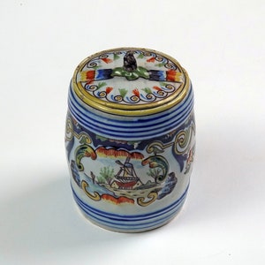 French Faience lidded pot marked Dinan on the base.