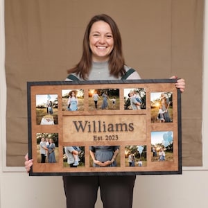 May include: A wooden family photo frame with a dark border, holding multiple family photos. The frame features the name "Williams" and the year "Est. 2023" engraved on the wood. The photos depict family members in various outdoor settings.