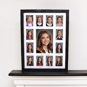 May include: A framed photo collage featuring a young woman's school portraits from kindergarten through 11th grade. The black frame surrounds individual photos, with the central image being a larger portrait. The name "Cassandra Rose" is written in cursive.