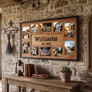 May include: A large wooden family photo collage with a black frame. The collage features multiple family photos and the name "Williams" with "Est. 2023" below it. The collage is displayed on a stone wall.