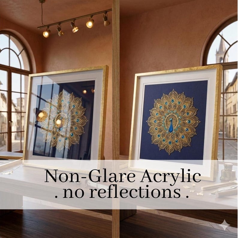 May include: Two framed artworks with gold frames and a peacock feather design on a dark blue background. The artwork features gold and teal accents. The text "Non-Glare Acrylic. no reflections." is visible at the bottom of the image.
