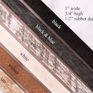 May include: A selection of wood picture frame samples in various colors, including tan, walnut, white, gray, black and blue, and black. The frames are 1 inch wide, 3/4 inch high, and have a 1/2 inch rabbet depth.