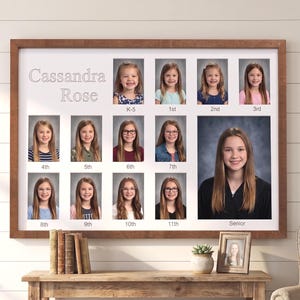May include: A framed school photo display featuring the name "Cassandra Rose" above individual portraits of a young person from K-5 through Senior year. The frame is brown, and the background is white.