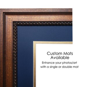 May include: A framed artwork with a dark wood frame and a navy blue mat. The frame has a decorative beaded edge. Text on the image reads "Custom Mats Available" and "Enhance your photos/art with a single or double mat."