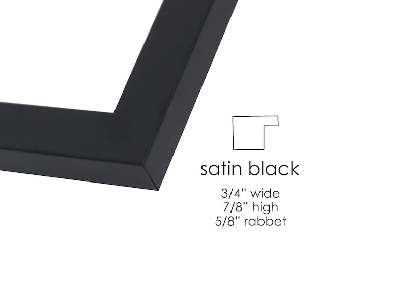 May include: Satin black picture frame corner. The frame is 3/4 inch wide, 7/8 inch high, and has a 5/8 inch rabbet. The text "satin black" is displayed below the frame corner.