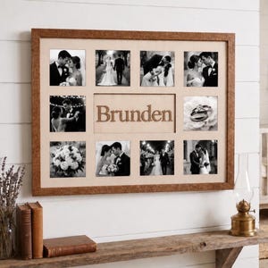May include: A rectangular wooden collage picture frame with a light-colored mat board featuring the word Brunden in the center. The frame contains eight black and white photographs of a wedding and a close-up image of two wedding rings.