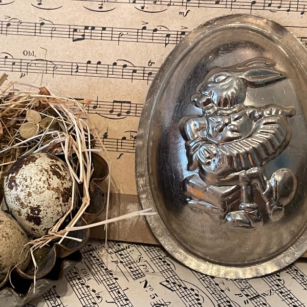 Ancient chocolate mold, egg "Rabbit with accordion"