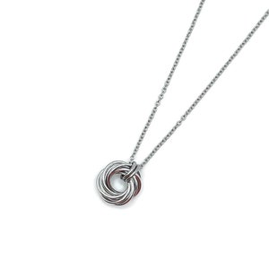 May include: A silver chain necklace with a silver pendant in the shape of a circle. The pendant is made of multiple intertwined rings.
