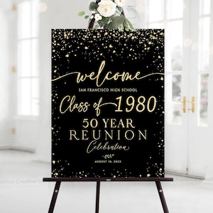 May include: A black rectangular welcome sign featuring gold confetti accents and text that reads: welcome, SAN FRANCISCO HIGH SCHOOL, Class of 1980, 50 YEAR REUNION, Celebration, AUGUST 18, 20XX. The sign is displayed on a dark brown easel.