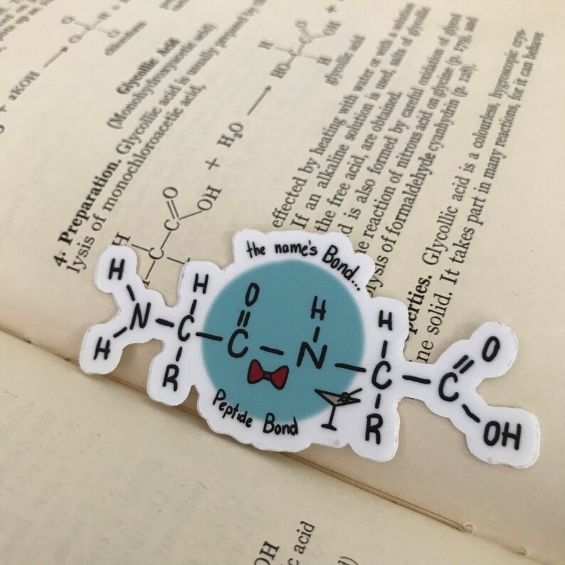 May include: A sticker with a cartoon illustration of a peptide bond, a type of chemical bond that links amino acids together to form proteins. The sticker is blue with a red bow and the text "the name's Bond..." and "Peptide Bond".