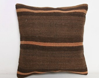 May include: A brown and beige striped throw pillow with a woven texture.