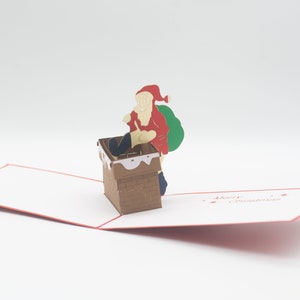 Santa comes down the Chimney Pop Up Card