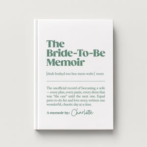 May include: A white hardcover book titled The Bride-To-Be Memoir in sage green text. The cover includes a phonetic pronunciation, the definition of the title, and the text A memoir by: Charlotte in a script font, centered on the front cover.