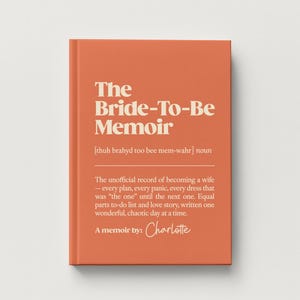 May include: A hardcover book with a burnt orange cover and cream-colored text. The title reads The Bride-To-Be Memoir, followed by a phonetic pronunciation, a definition of the term, and the author name Charlotte in a script font.