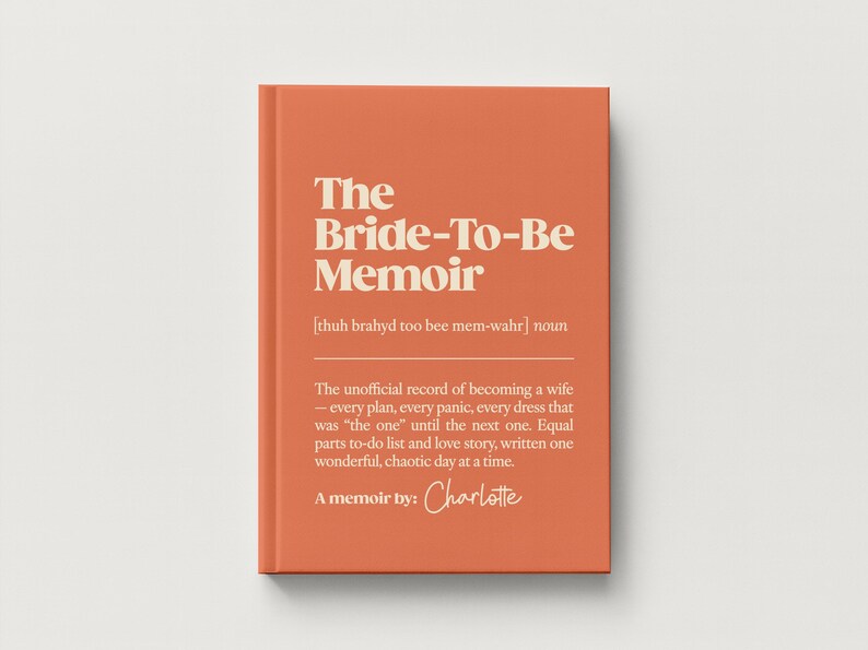 May include: A hardcover book with a burnt orange cover and cream-colored text. The title reads The Bride-To-Be Memoir, followed by a phonetic pronunciation, a definition of the term, and the author name Charlotte in a script font.