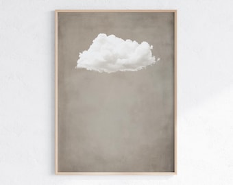 May include: A framed print of a single white cloud against a light brown background.