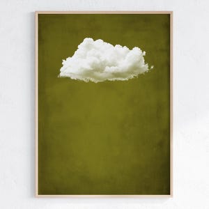 May include: A single white cloud against a solid olive green background. The cloud is in the upper center of the image.