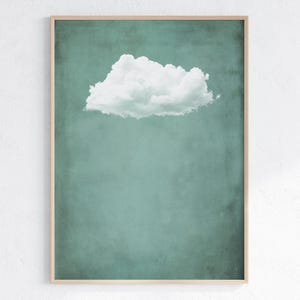 May include: A single white cloud against a teal green background. The cloud is in the upper centre of the image.