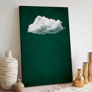 May include: A white cloud against a dark green background. The cloud is in the center of the image and is the main focus. The background is a solid color.