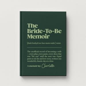 May include: A dark green hardcover book titled The Bride-To-Be Memoir with light green text. The cover includes a phonetic pronunciation, the noun definition, and the text A memoir by: Charlotte in a script font centered on the front cover.