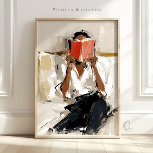 May include: An impressionistic art print featuring a figure with dark skin wearing a white shirt and black trousers, sitting while holding an open bright red book in front of their face. The background consists of abstract cream and beige brushstrokes.