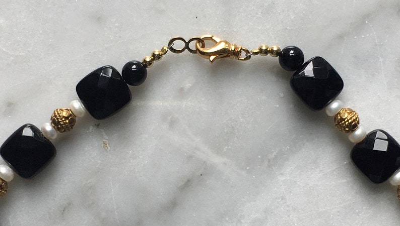 Onyx Vermeil and pearl.