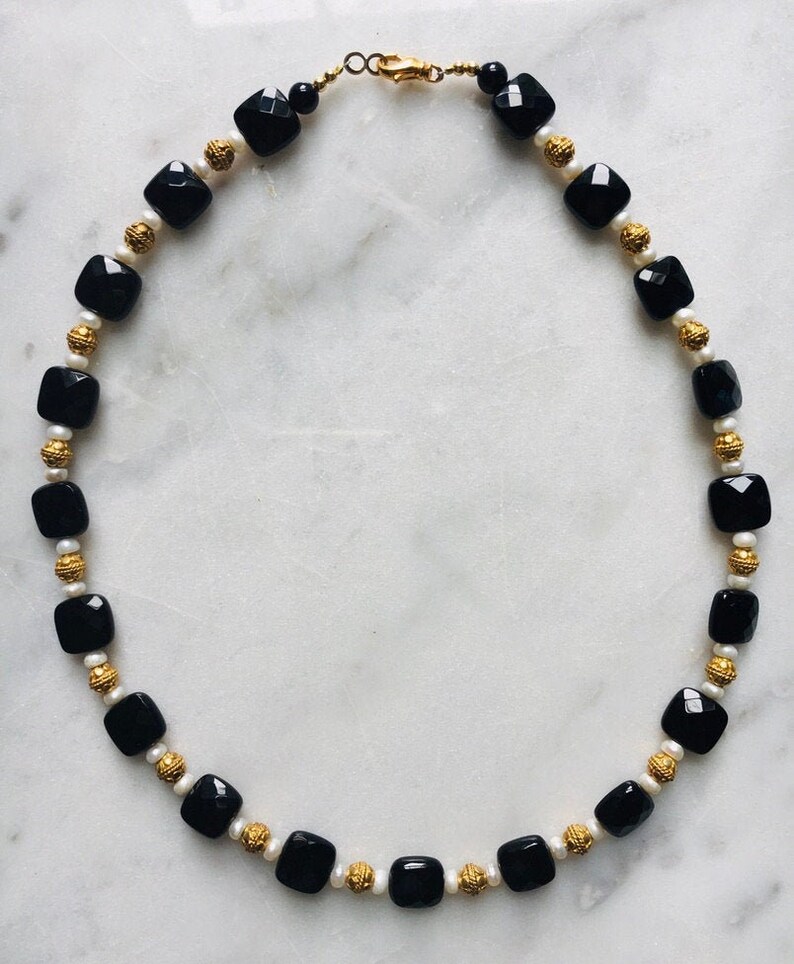 Onyx Vermeil and pearl.