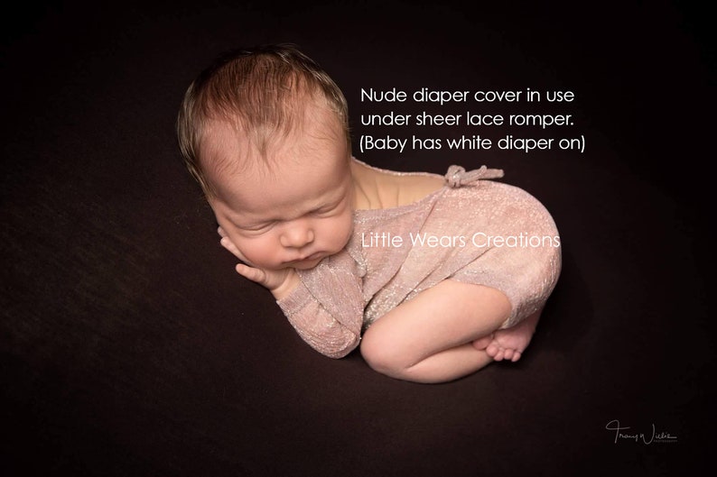 A newborn baby is wearing a nude skin colour diaper / nappy cover over a diaper. These covers are handmade by Little Wears Creations and an Etsy Bestseller. They are perfect for covering up the diaper, and a must have item for newborn photography.